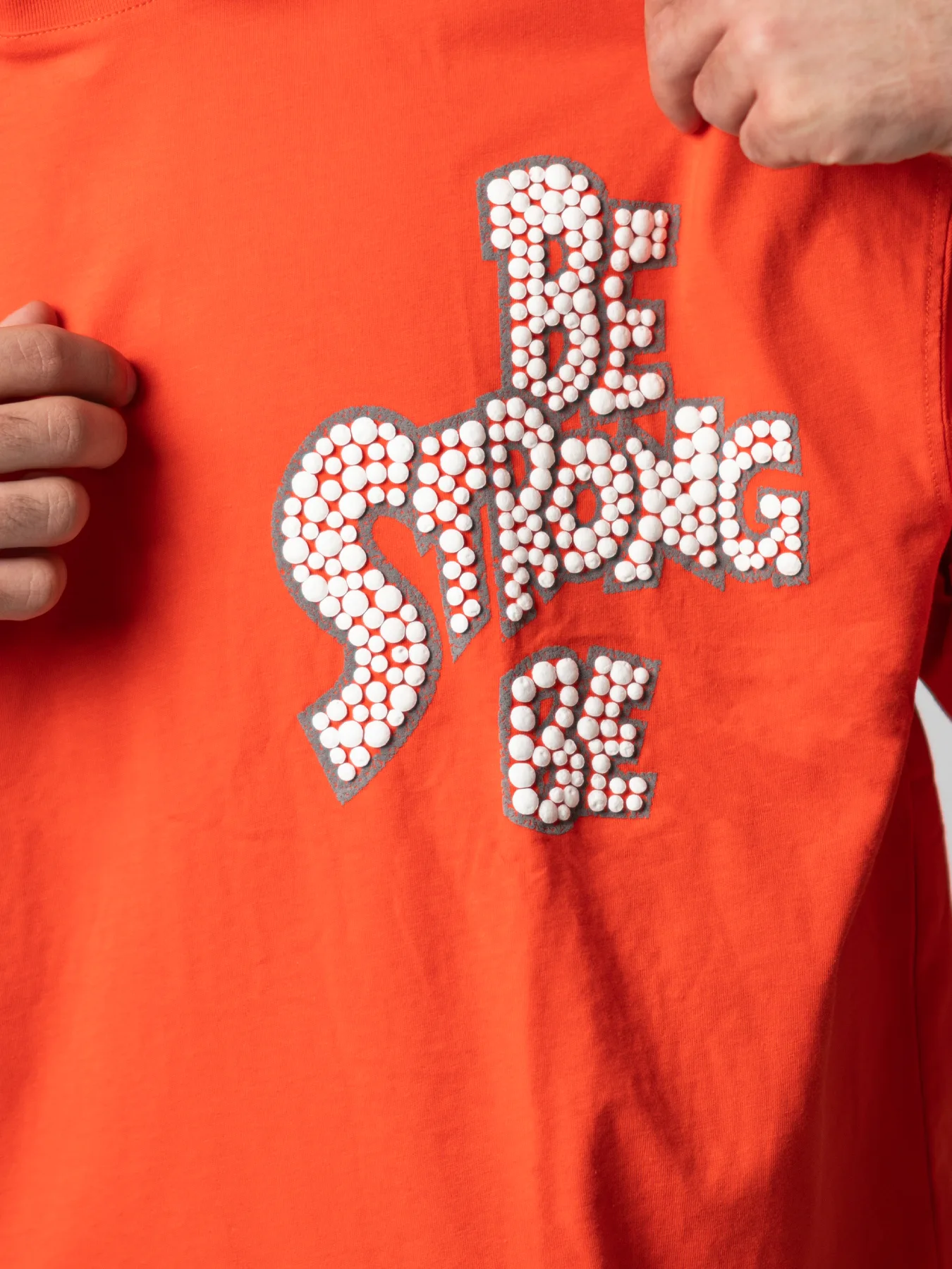 تیشرت نارنجی طرح دار یقه گرد طرح دار