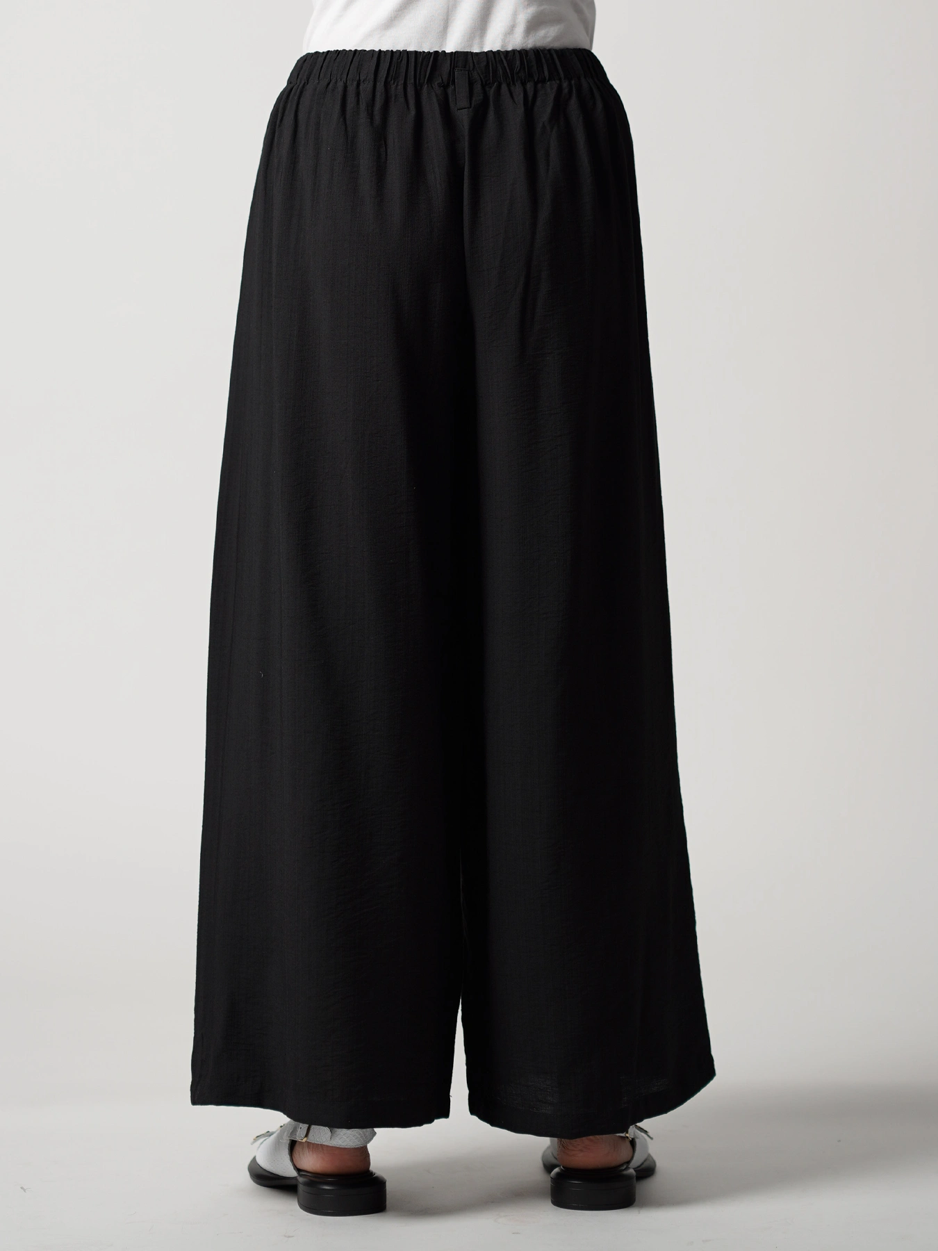 شلوار مشکی کمرکش تک دکمه ساده 